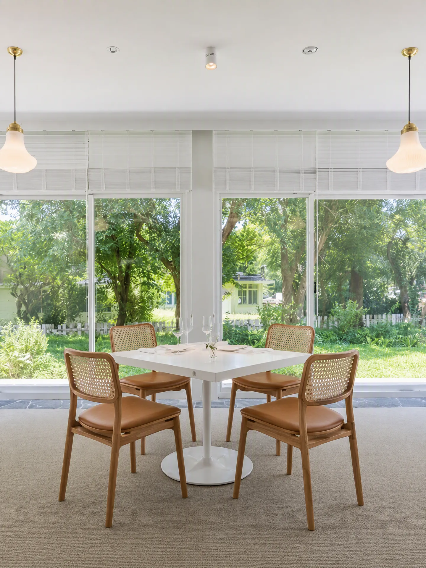 Cane-backed chairs arranged in the same dining room
