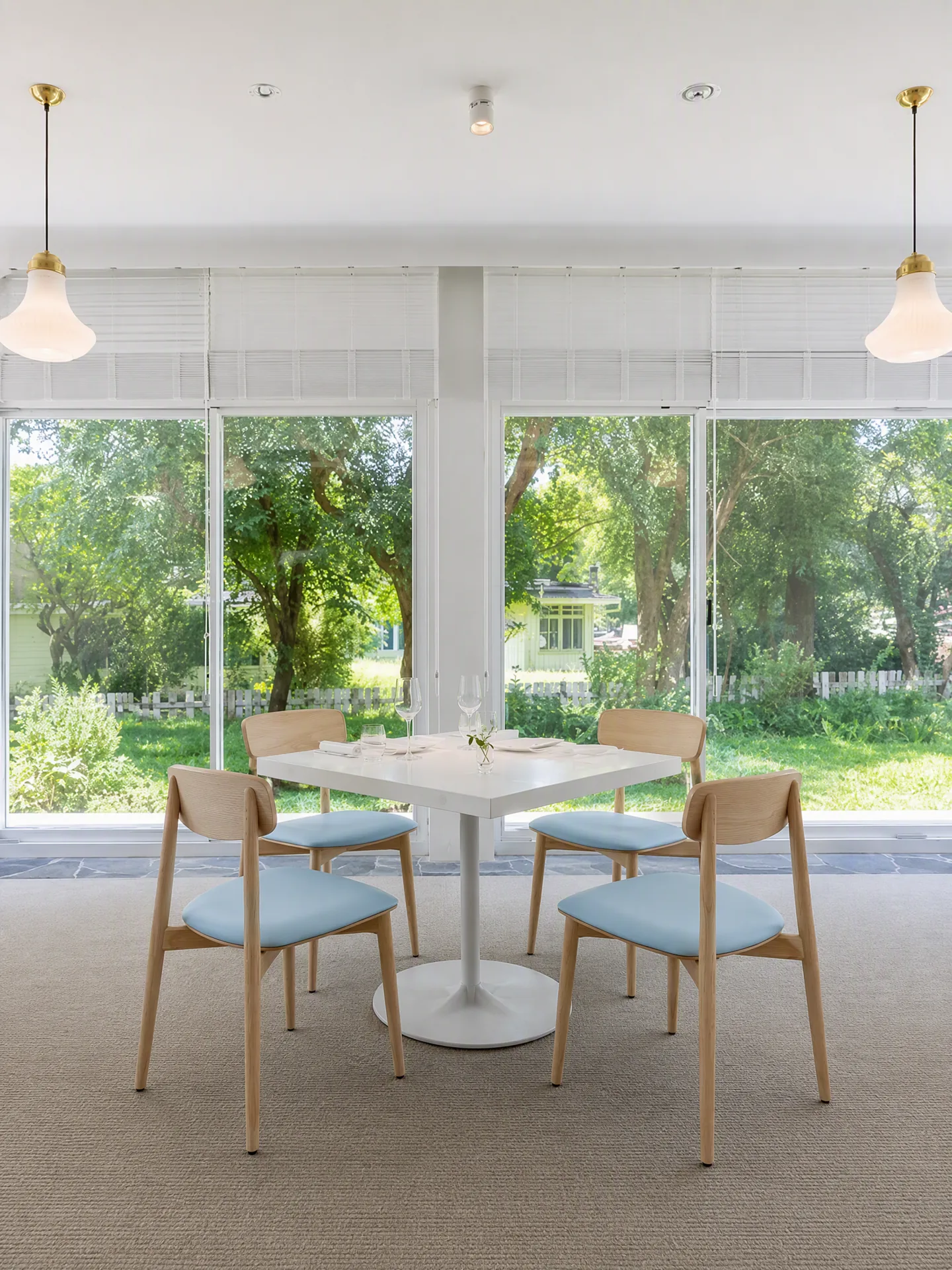 Blue-cushion wood-frame chairs arranged in the same dining room