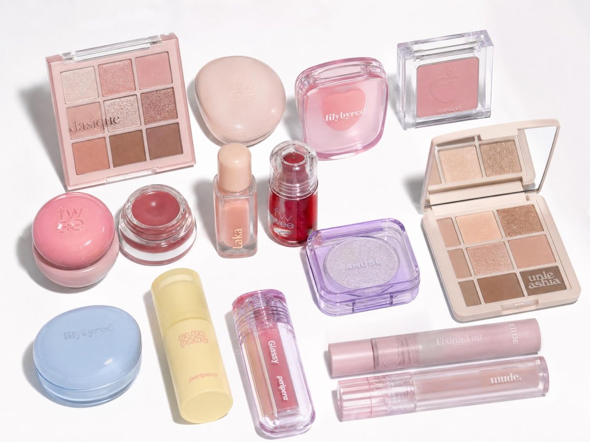 AI-generated flat-lay reference photo of pastel makeup compacts, eyeshadow palettes and lip products