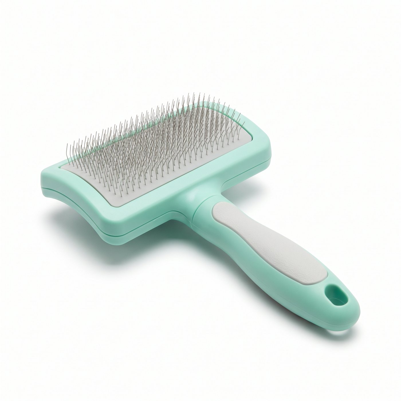 The rectangular mint grooming brush used as this test's input